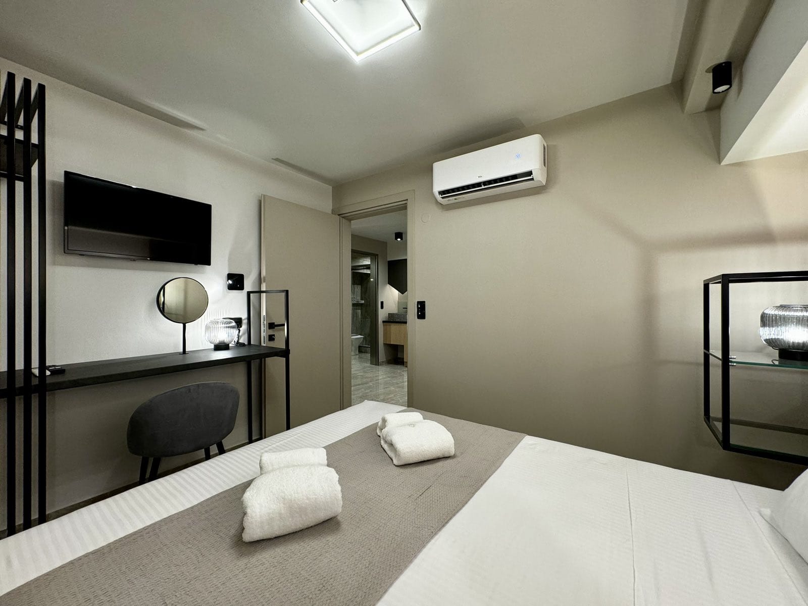 a room with a bed and a desk