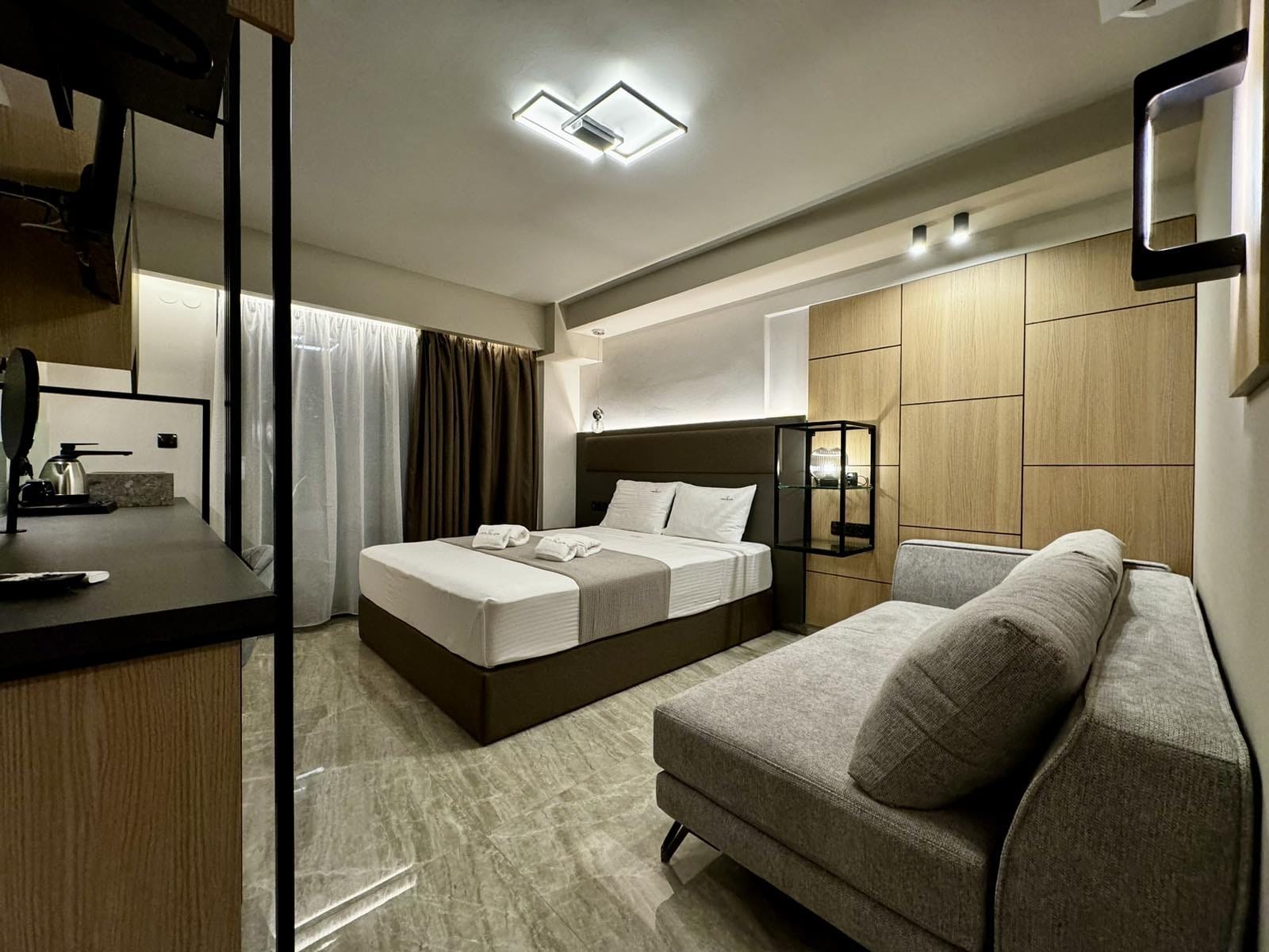 a bedroom with a bed and couch