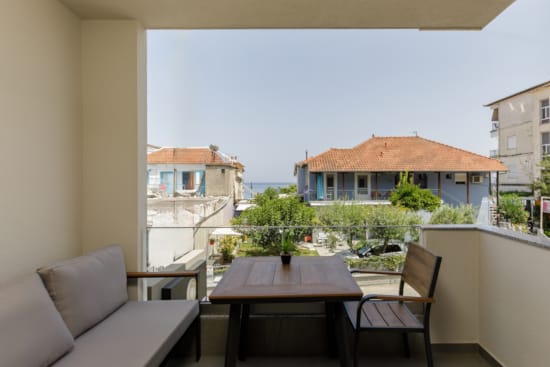 a table and chairs on a balcony