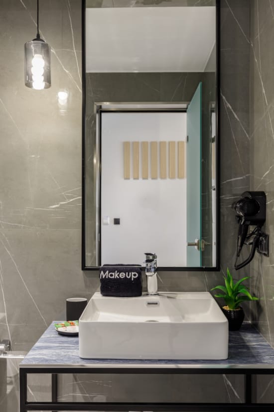 a bathroom with a sink and a mirror