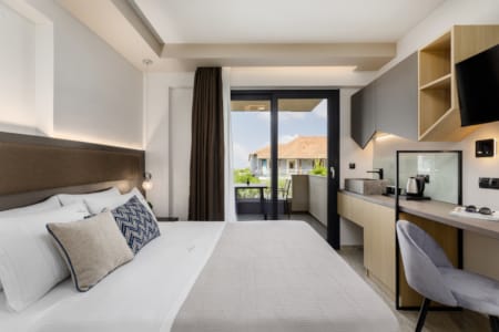 a bedroom with a large window