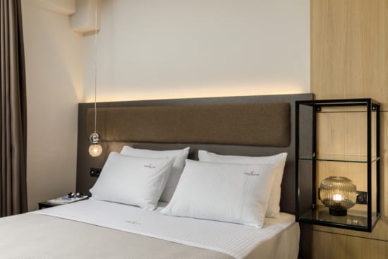 a bed with white sheets