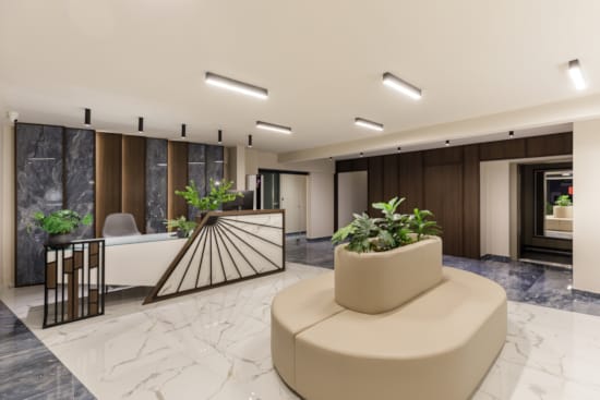 a room with a white couch and a white table with plants