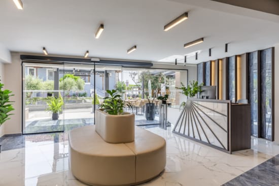 a room with a table and plants