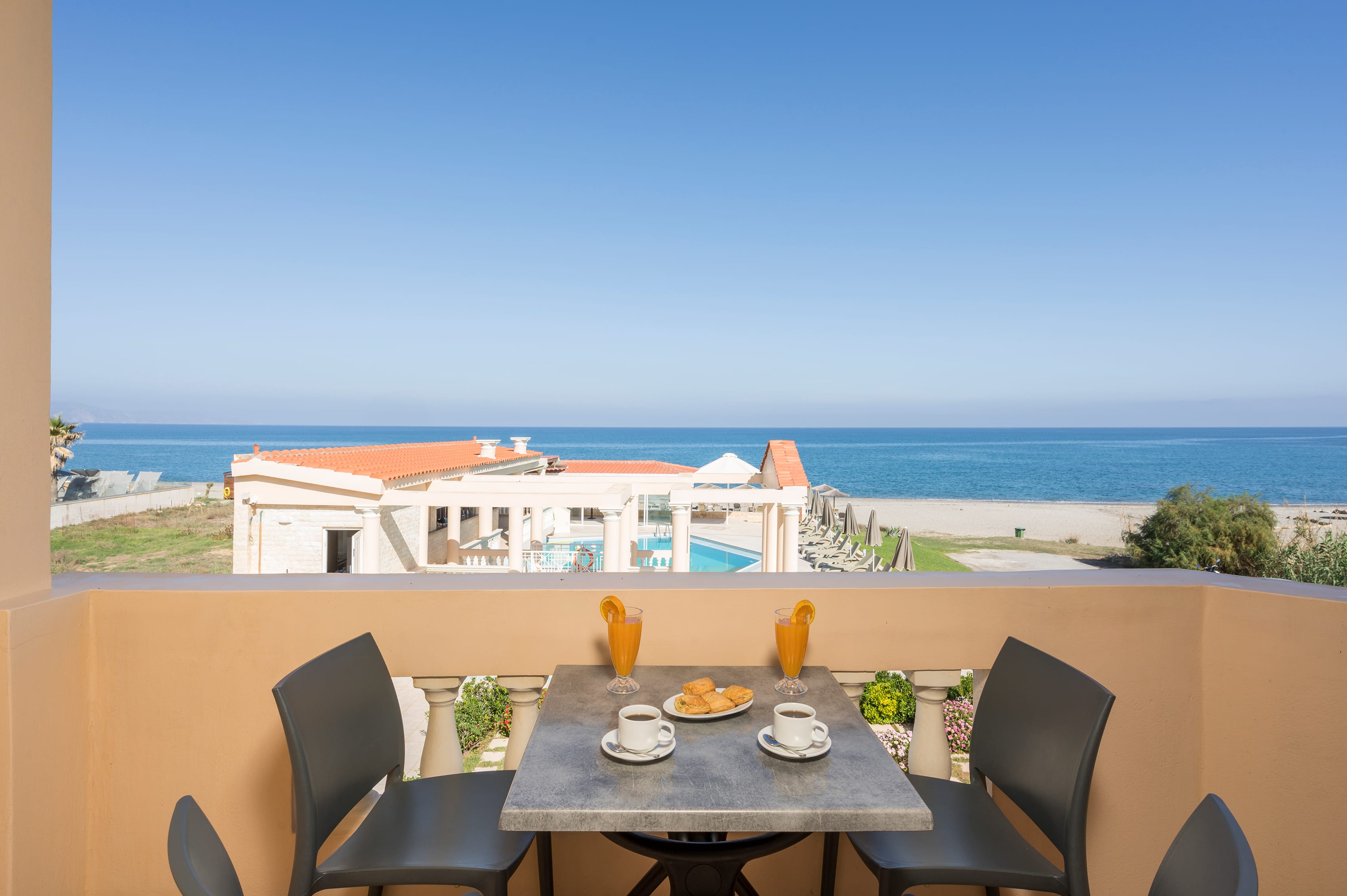 a table with food on it by a beach