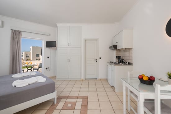 a bedroom with a bed and a table