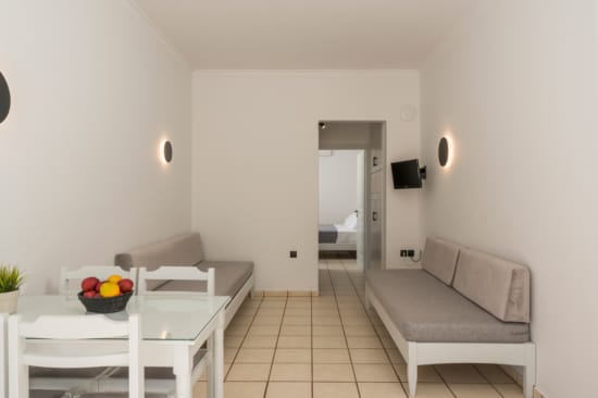 a room with a table and chairs