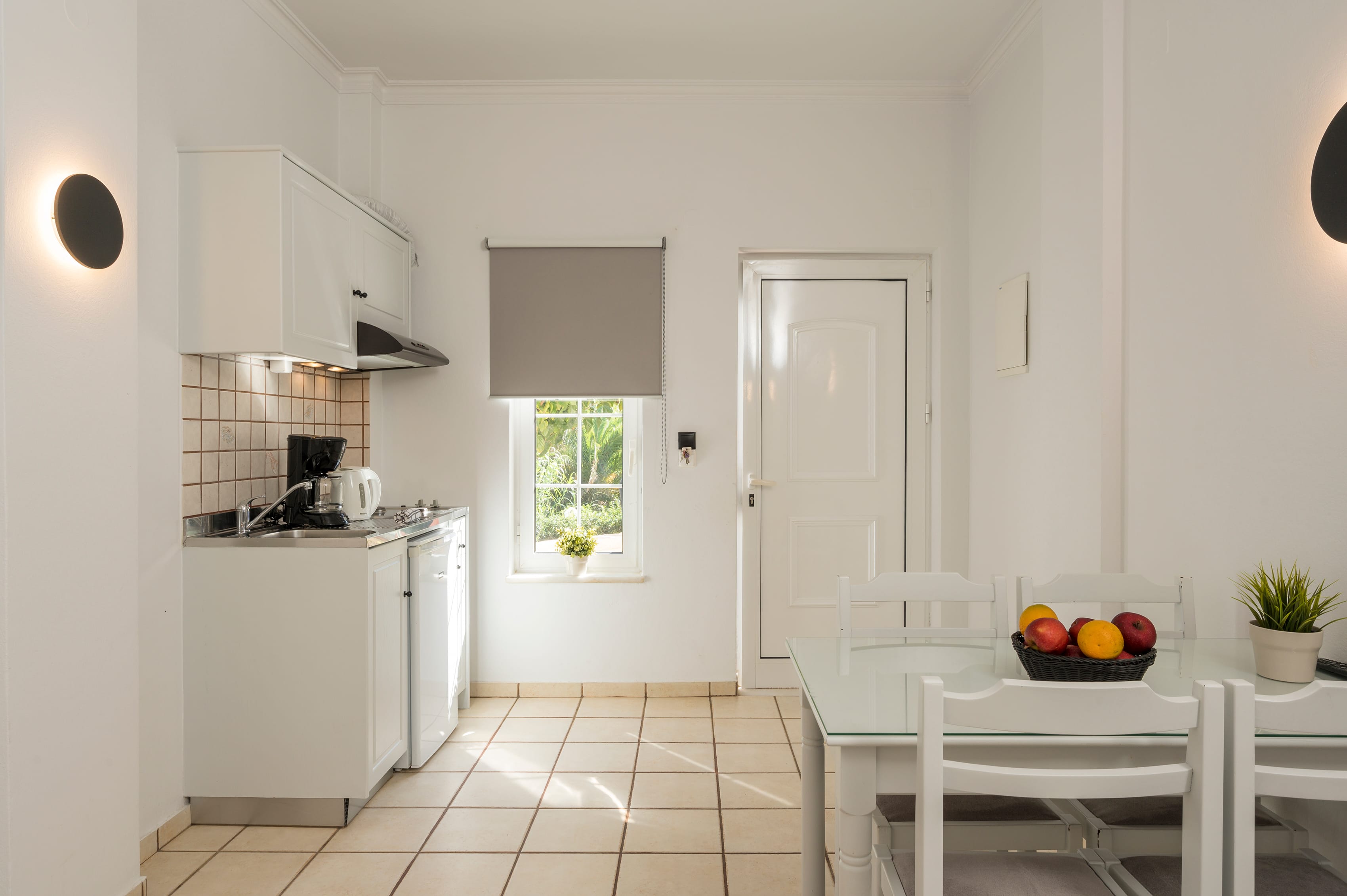 a kitchen with white cabinets