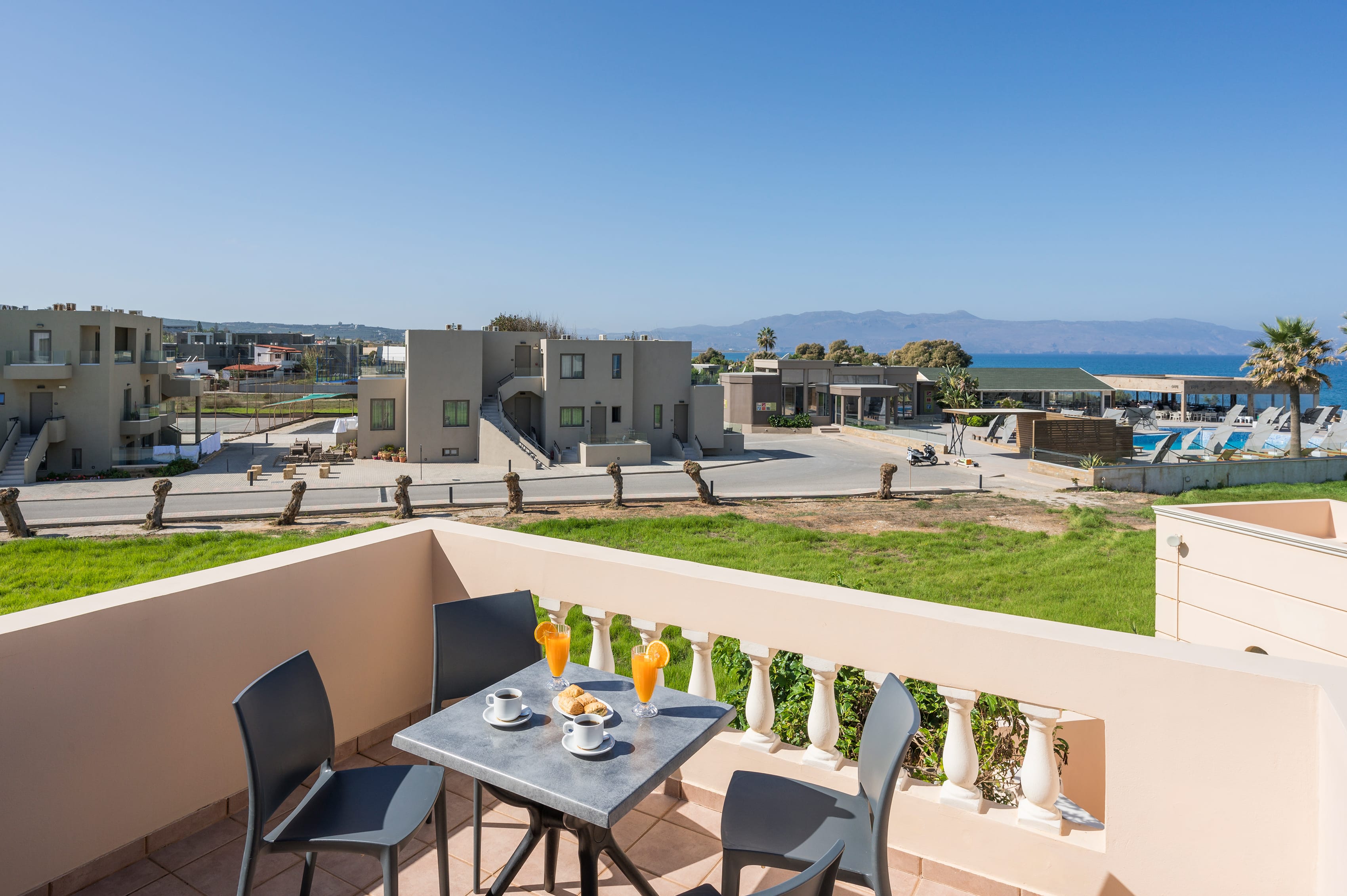 a table and chairs on a balcony