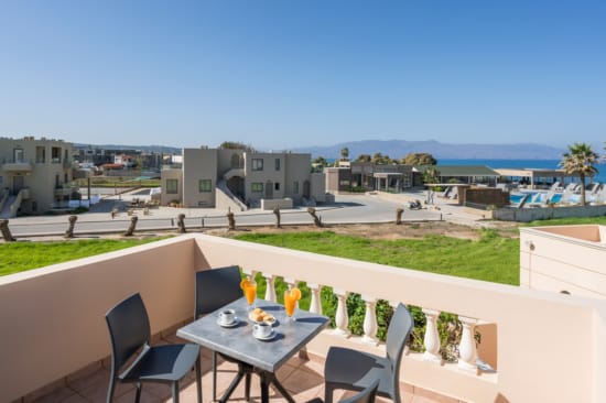 a table and chairs on a balcony