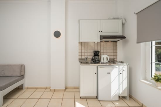 a kitchen with white cabinets