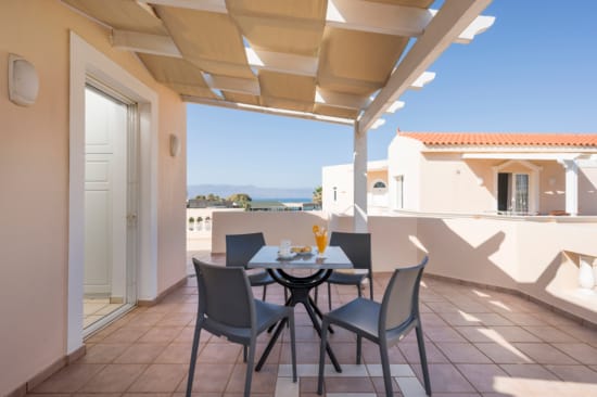 a table and chairs on a patio