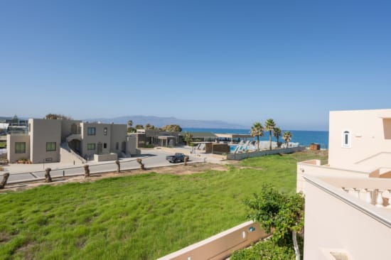 a group of buildings next to a body of water