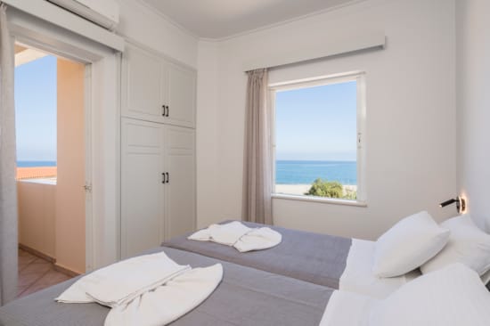 a bedroom with a large window