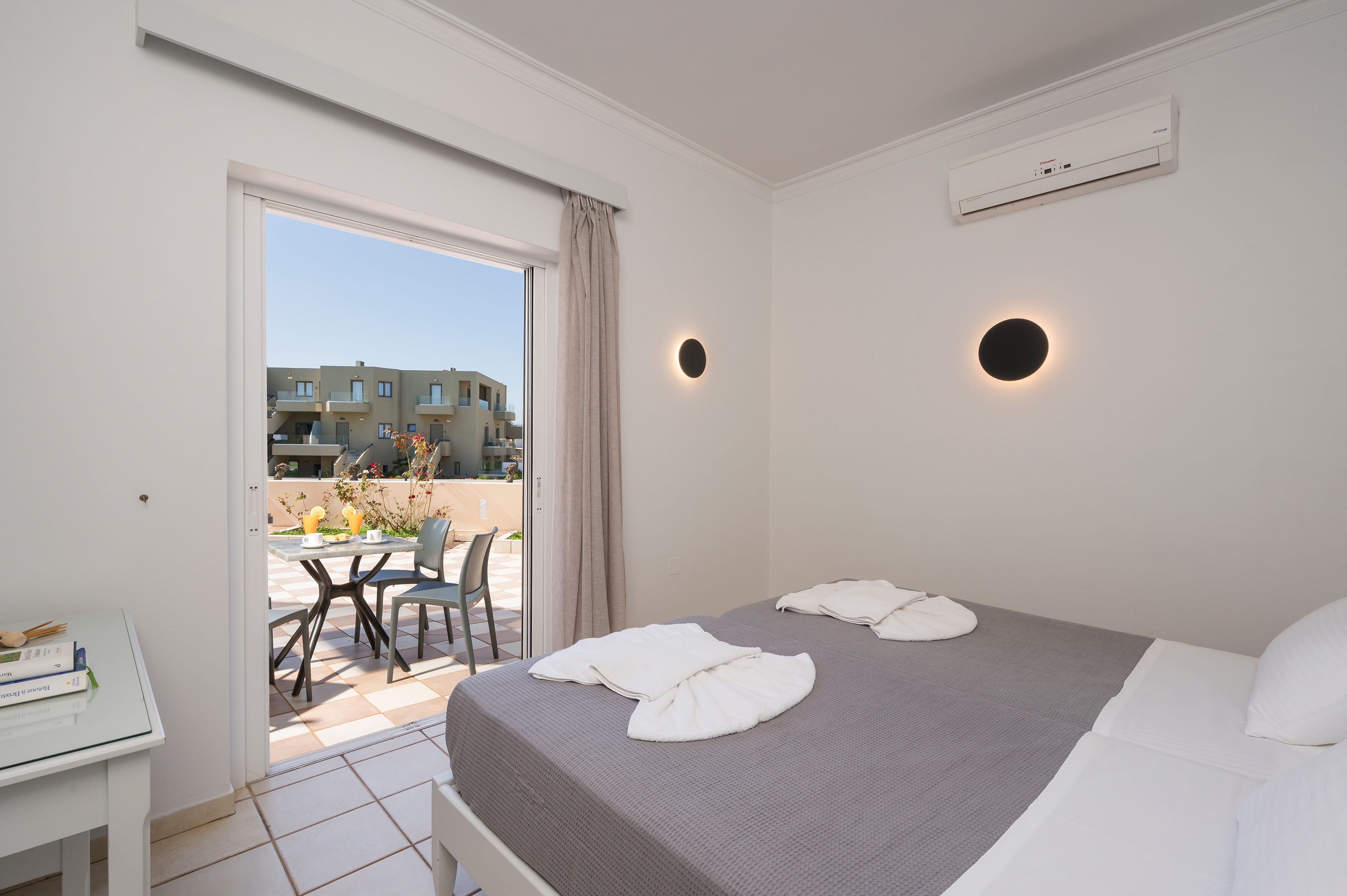 a bedroom with a large window