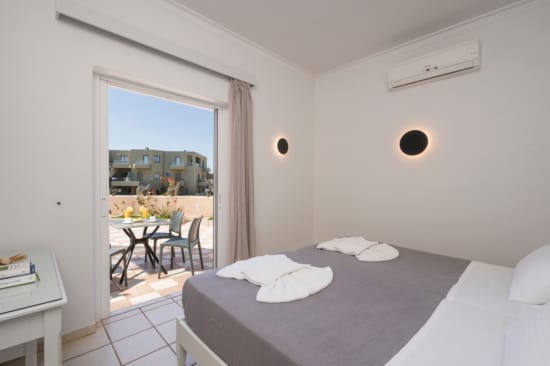 a bedroom with a large window