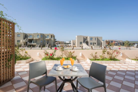 a table and chairs on a patio