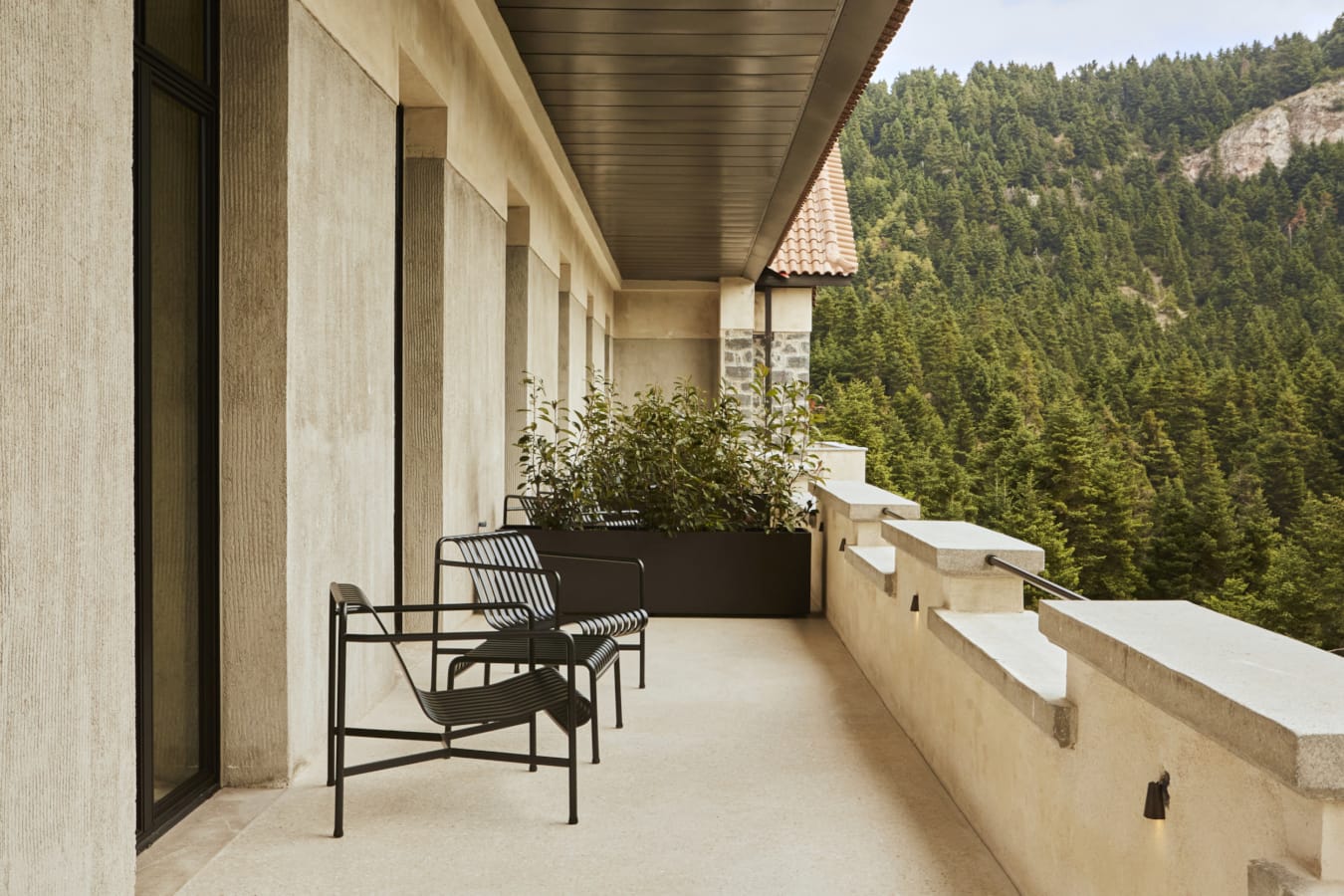 a patio with chairs and a table