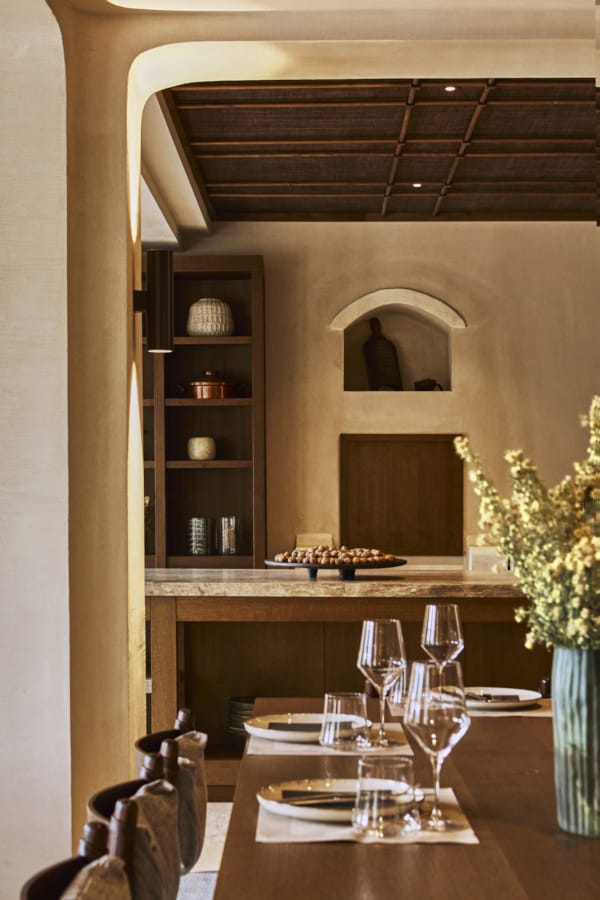 a dining table with plates and glasses