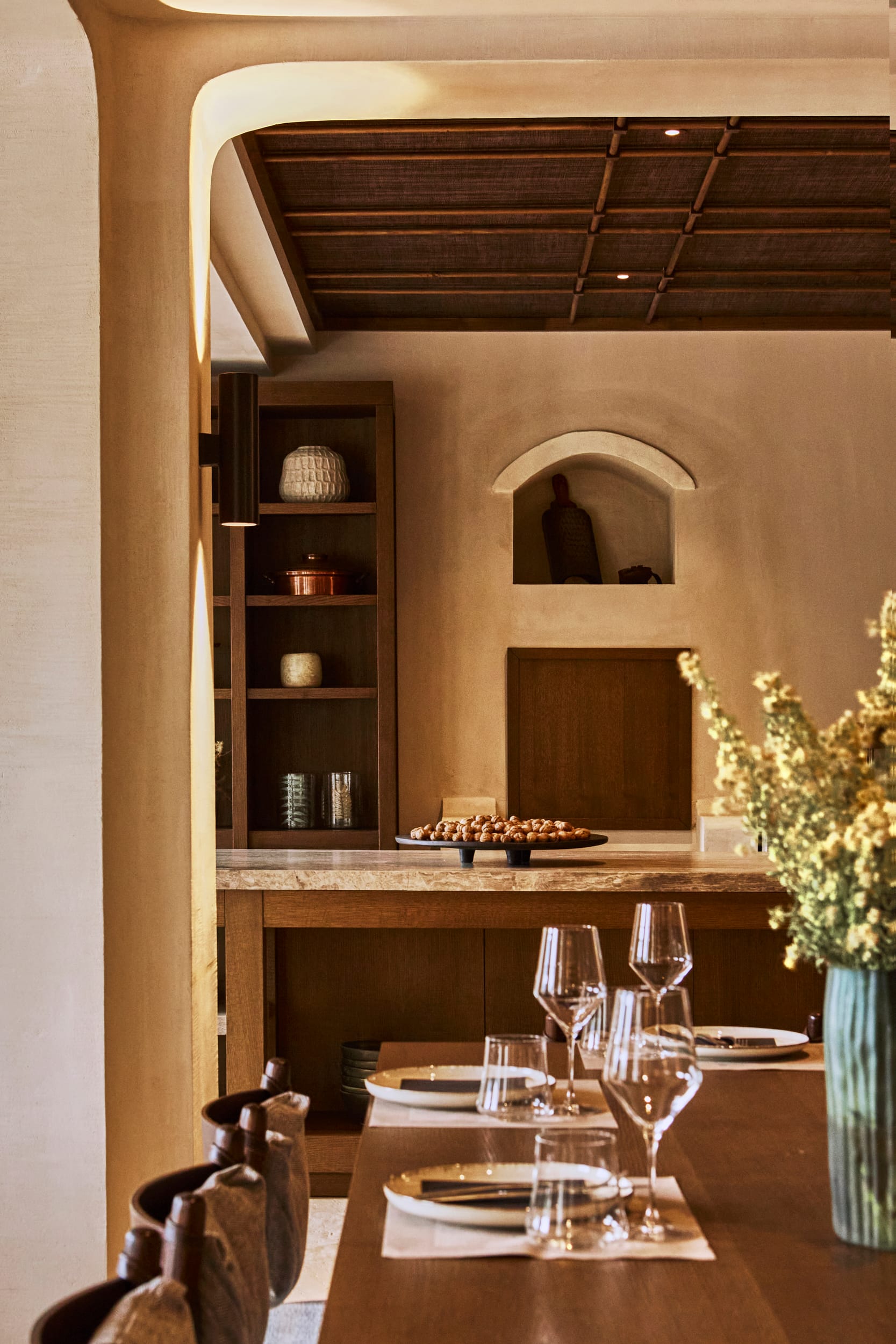 a dining table with plates and glasses