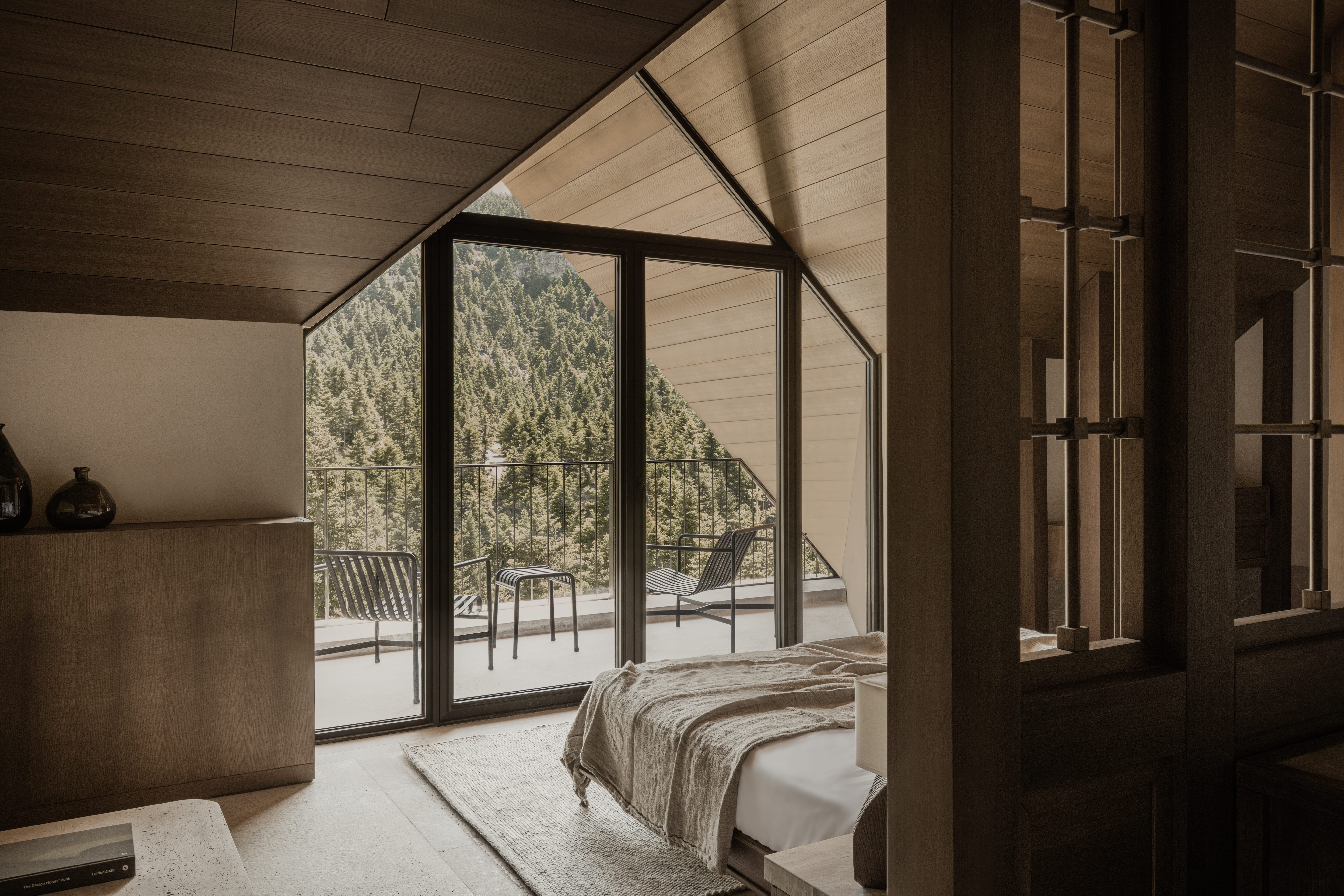 a bedroom with a large window