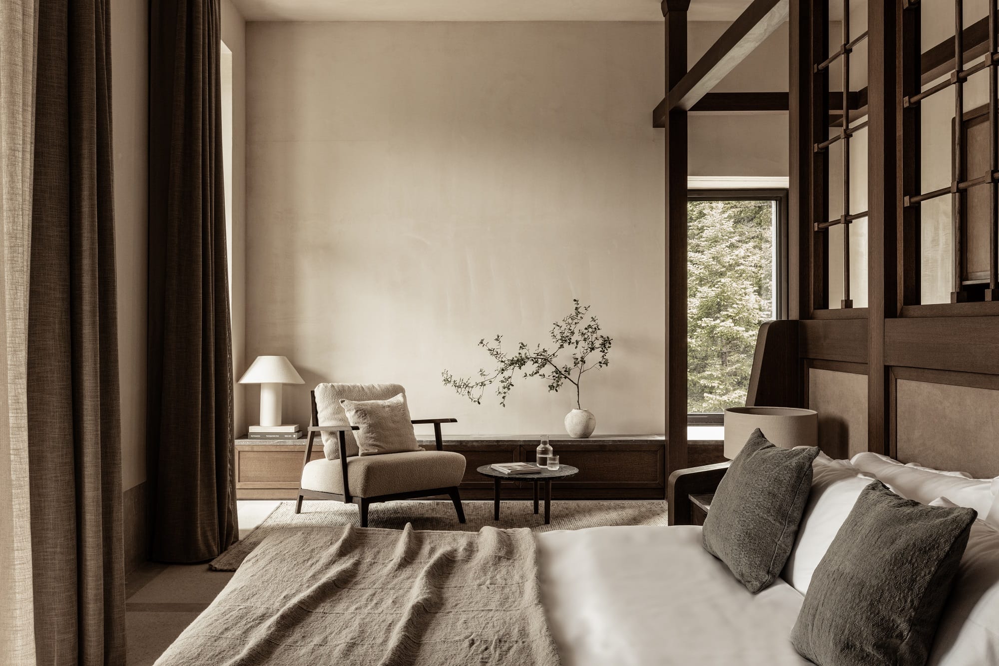 a bedroom with a bed and a chair