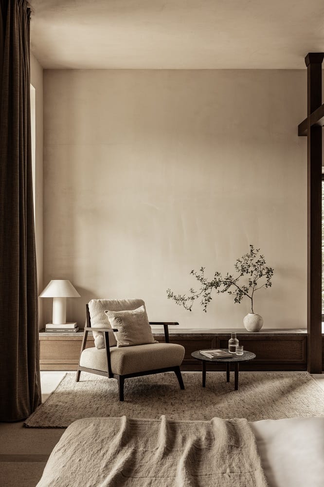 a living room with a chair and a table