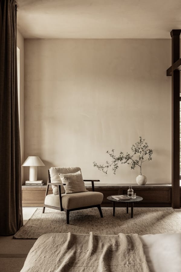 a living room with a chair and a table