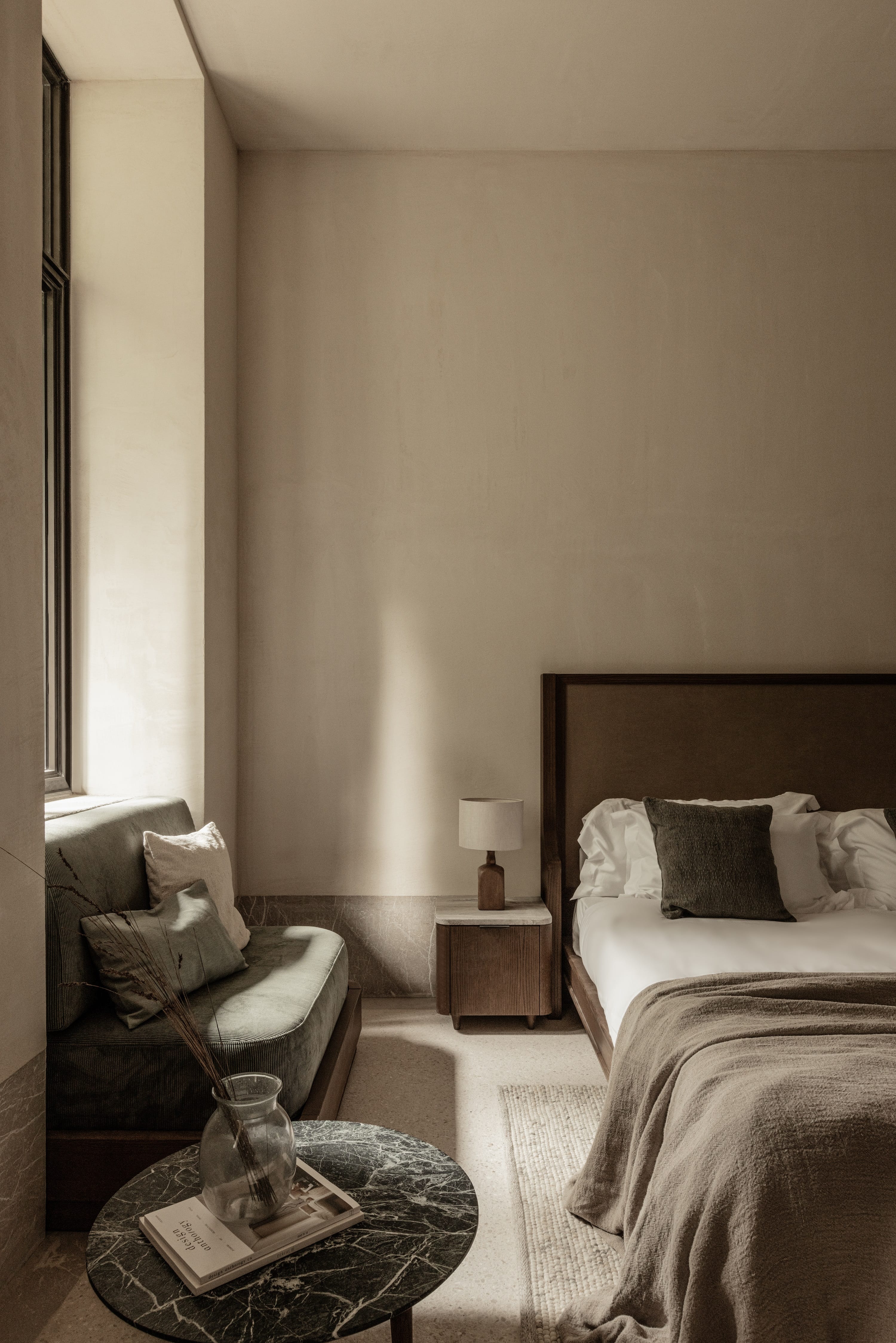 a bedroom with a bed and a coffee table