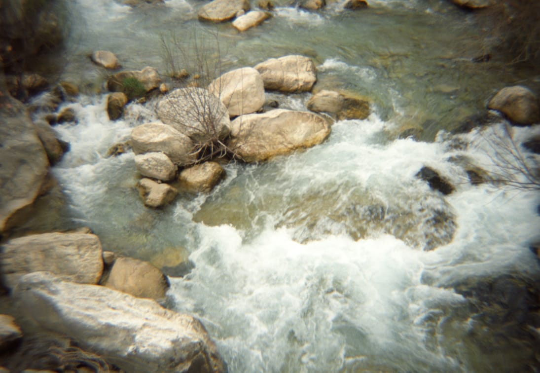 a river with rocks and water