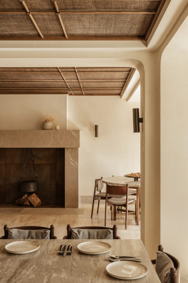 a dining room with a wood ceiling