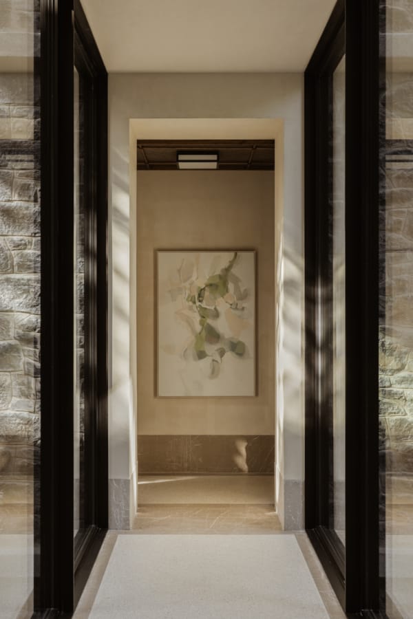 a doorway with a painting on the wall