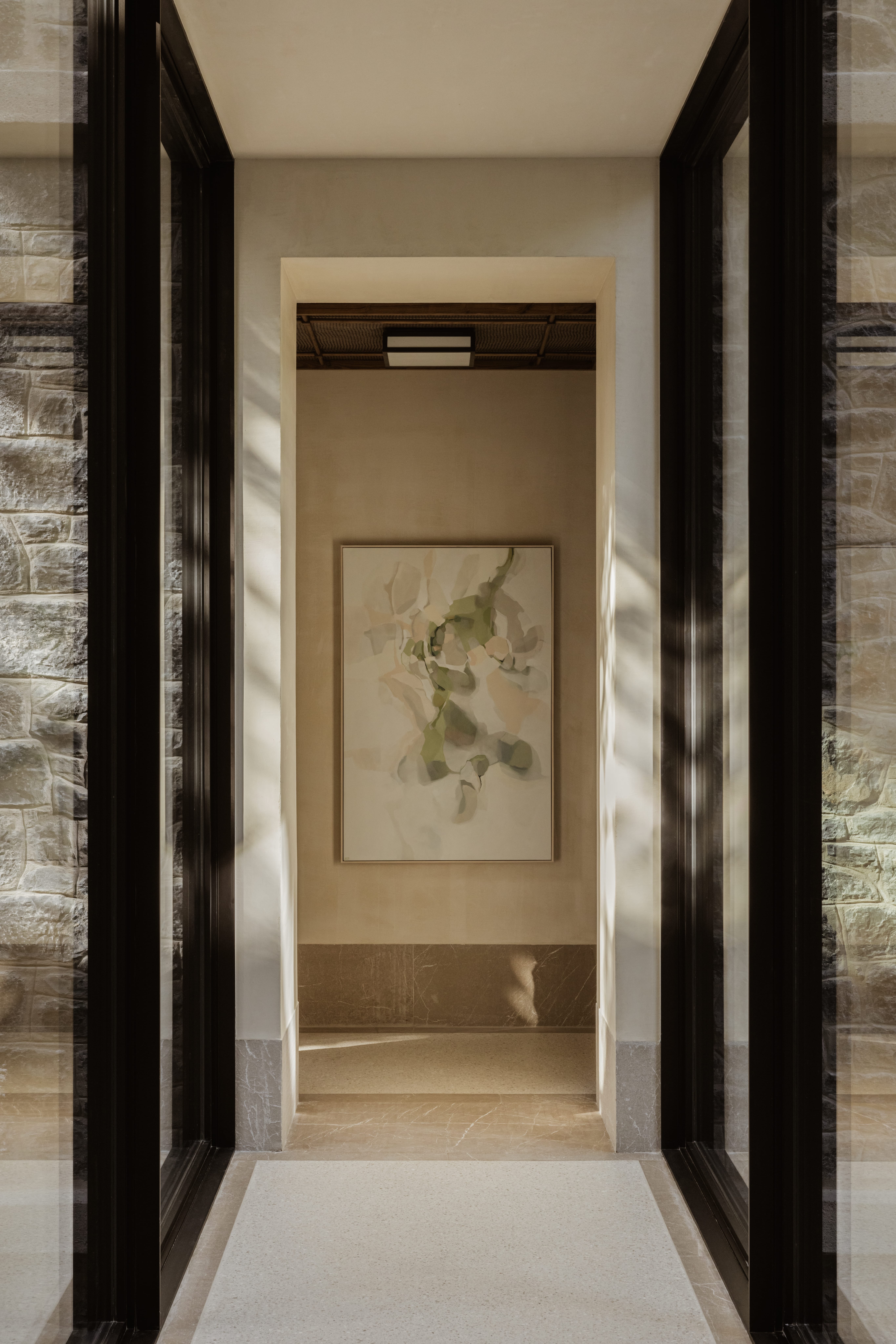 a doorway with a painting on the wall