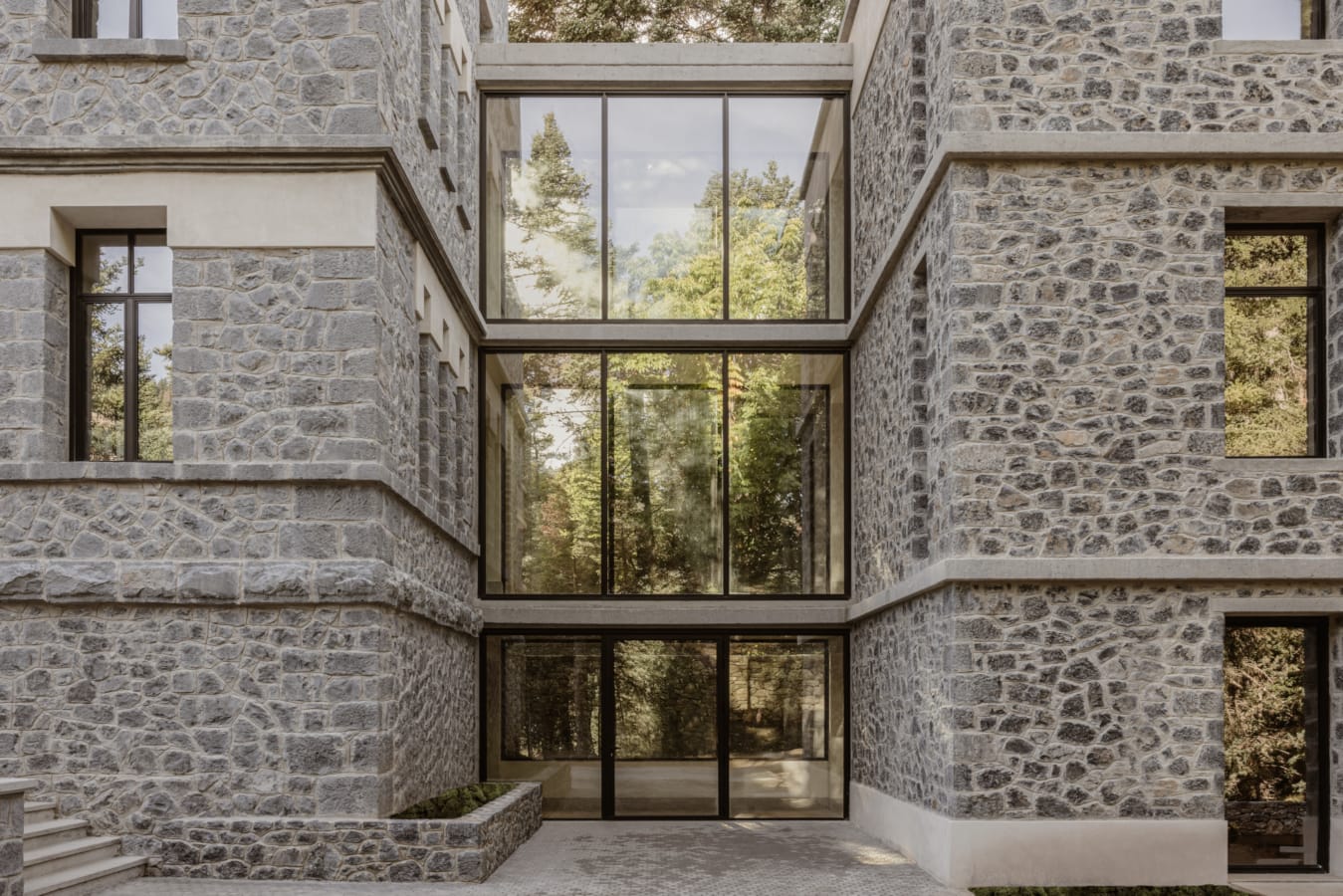 a stone building with a large window