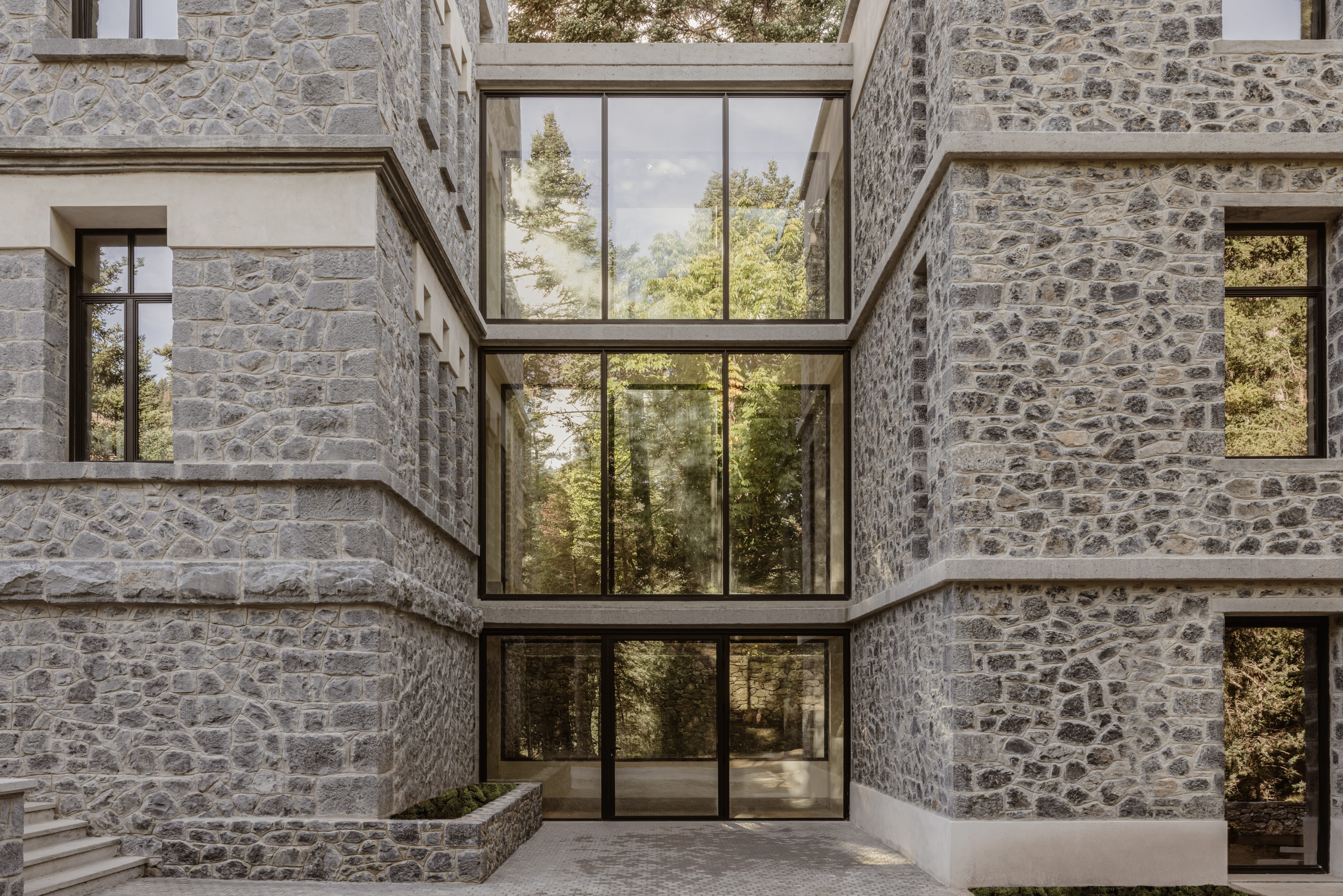 a stone building with a large window