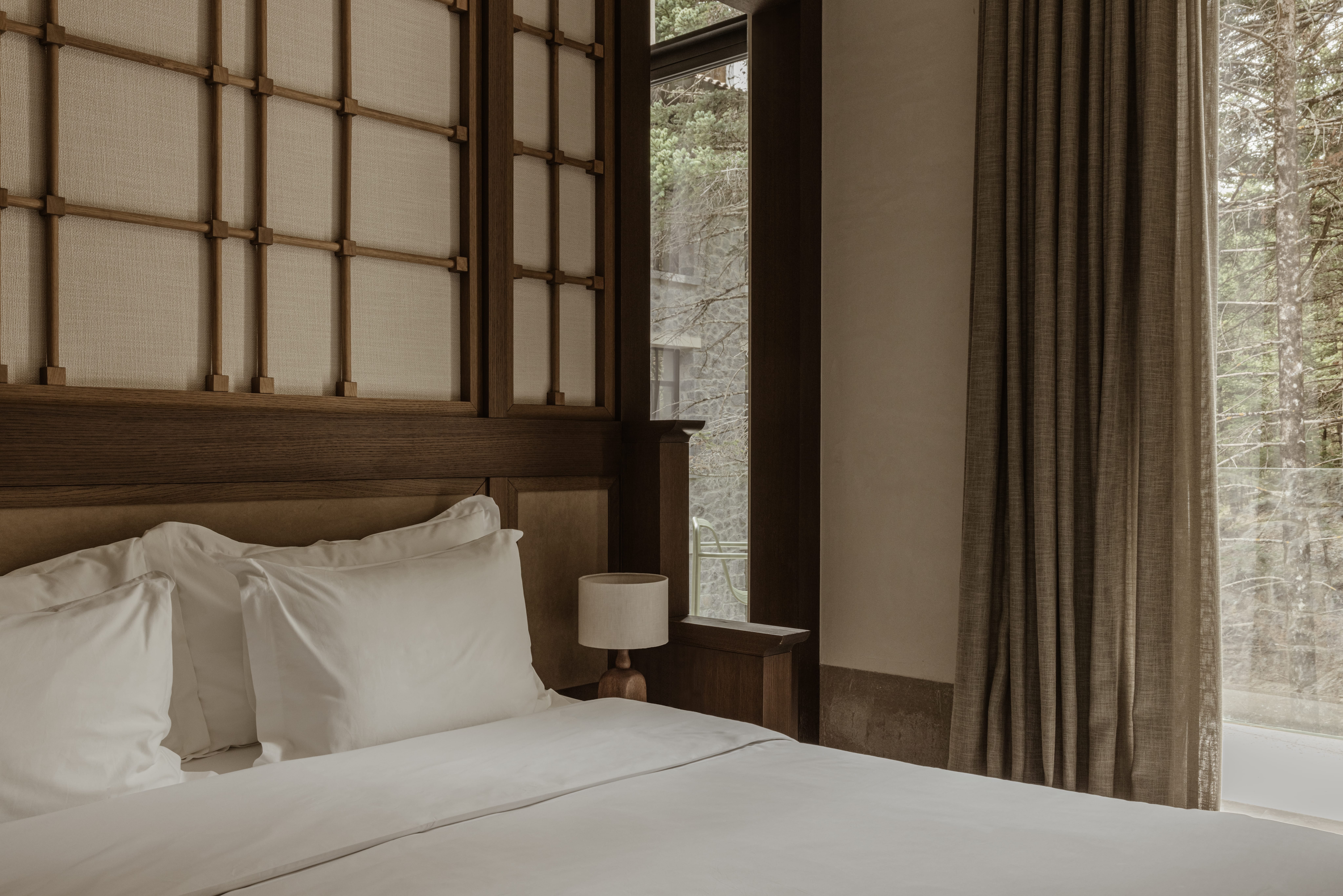 a bed with a lamp on it