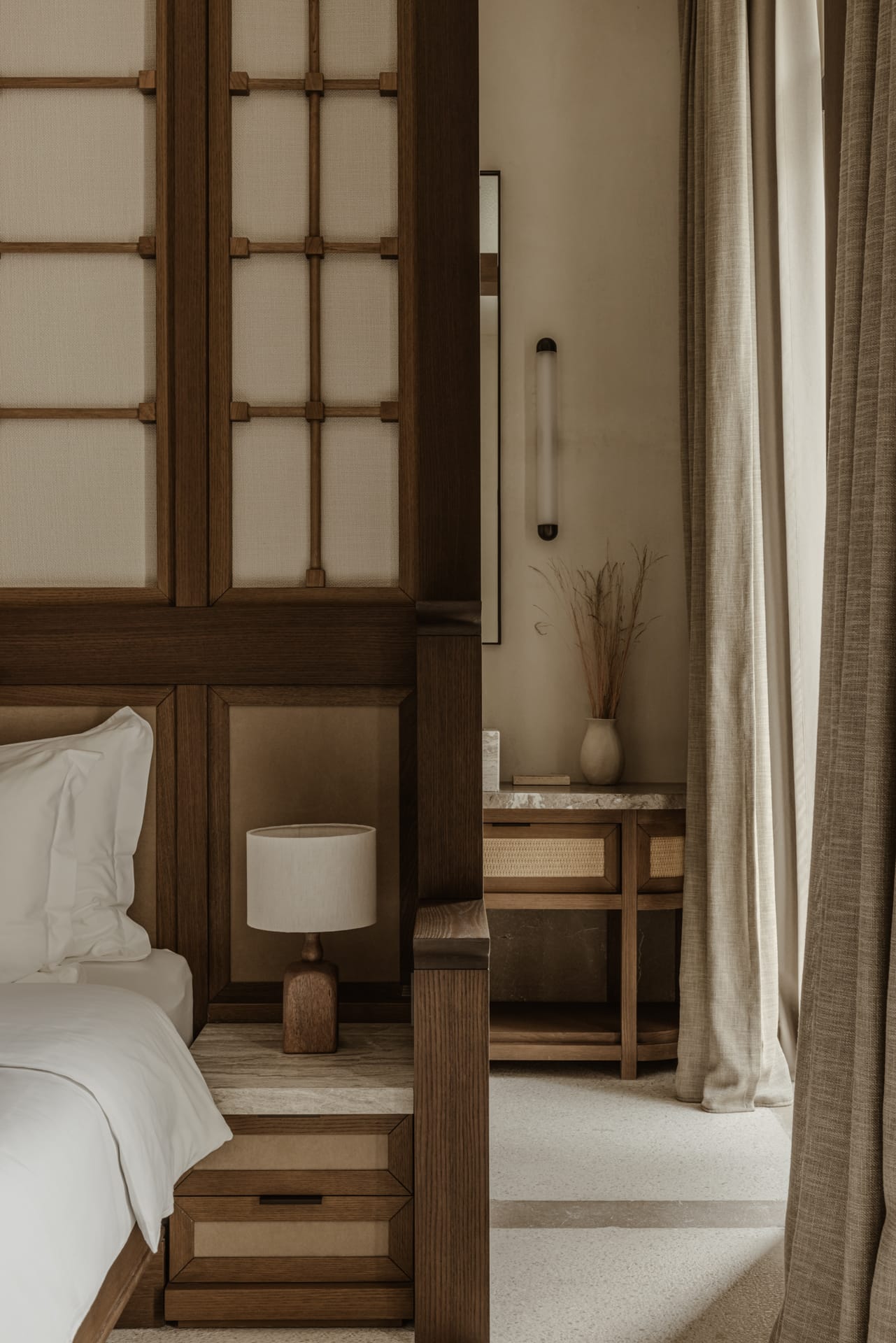 a room with a bed and a lamp