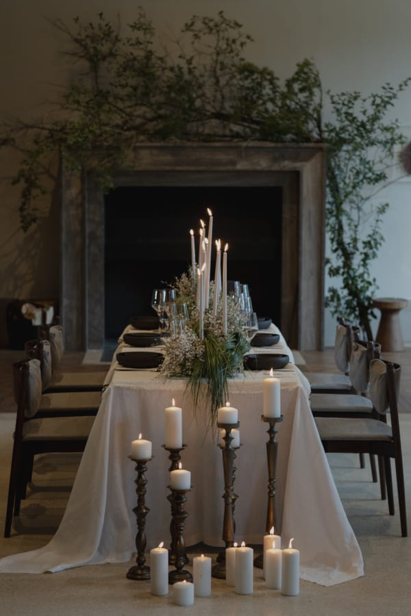 a table with candles and flowers