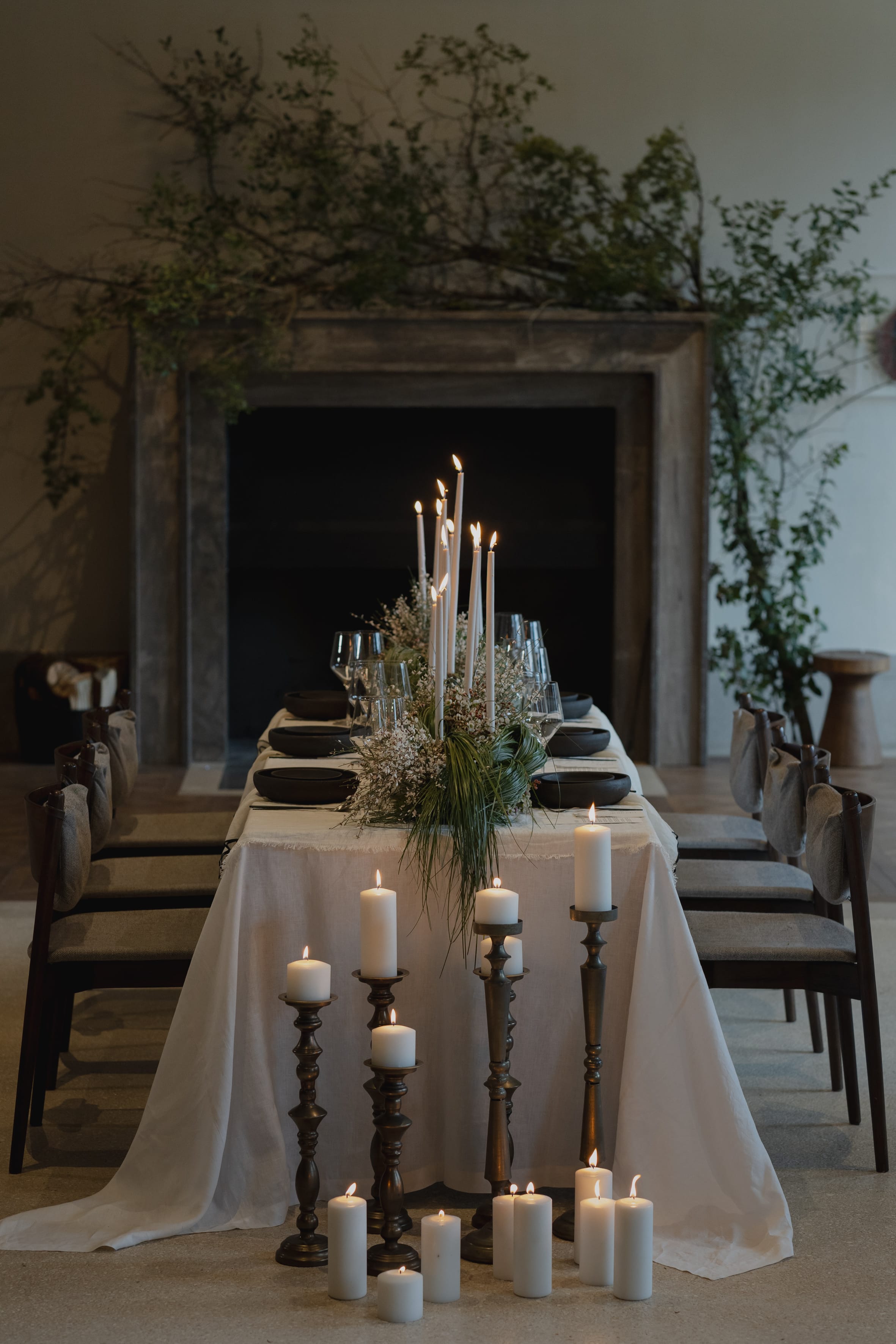 a table with candles and flowers