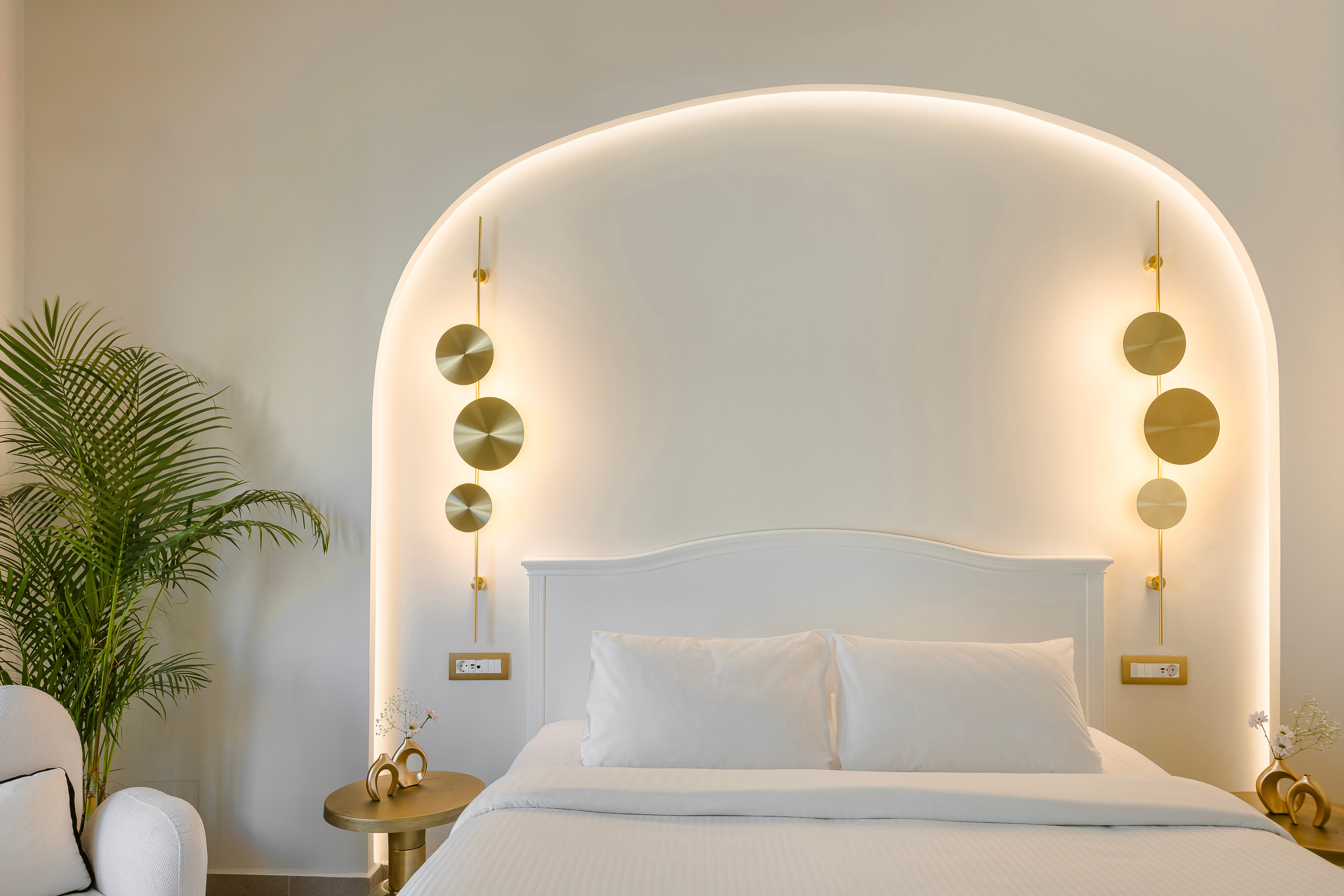 a bed with a white headboard