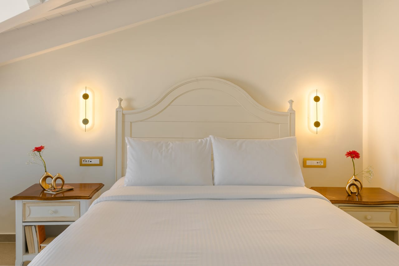 a bed with white sheets