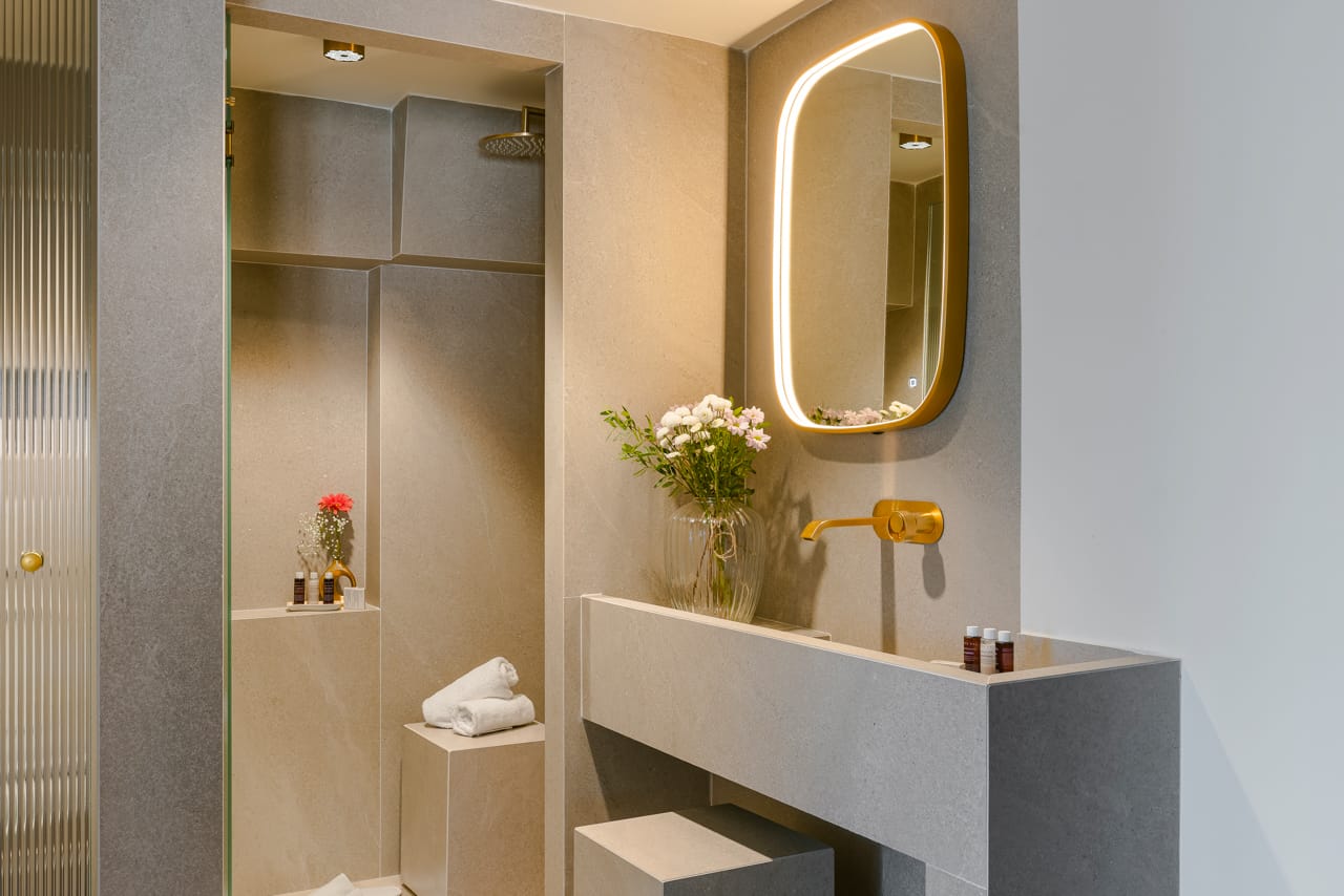 a bathroom with a mirror and a sink