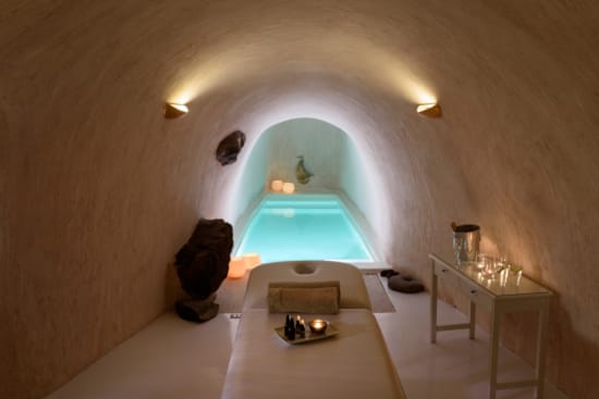 a room with a table and chairs