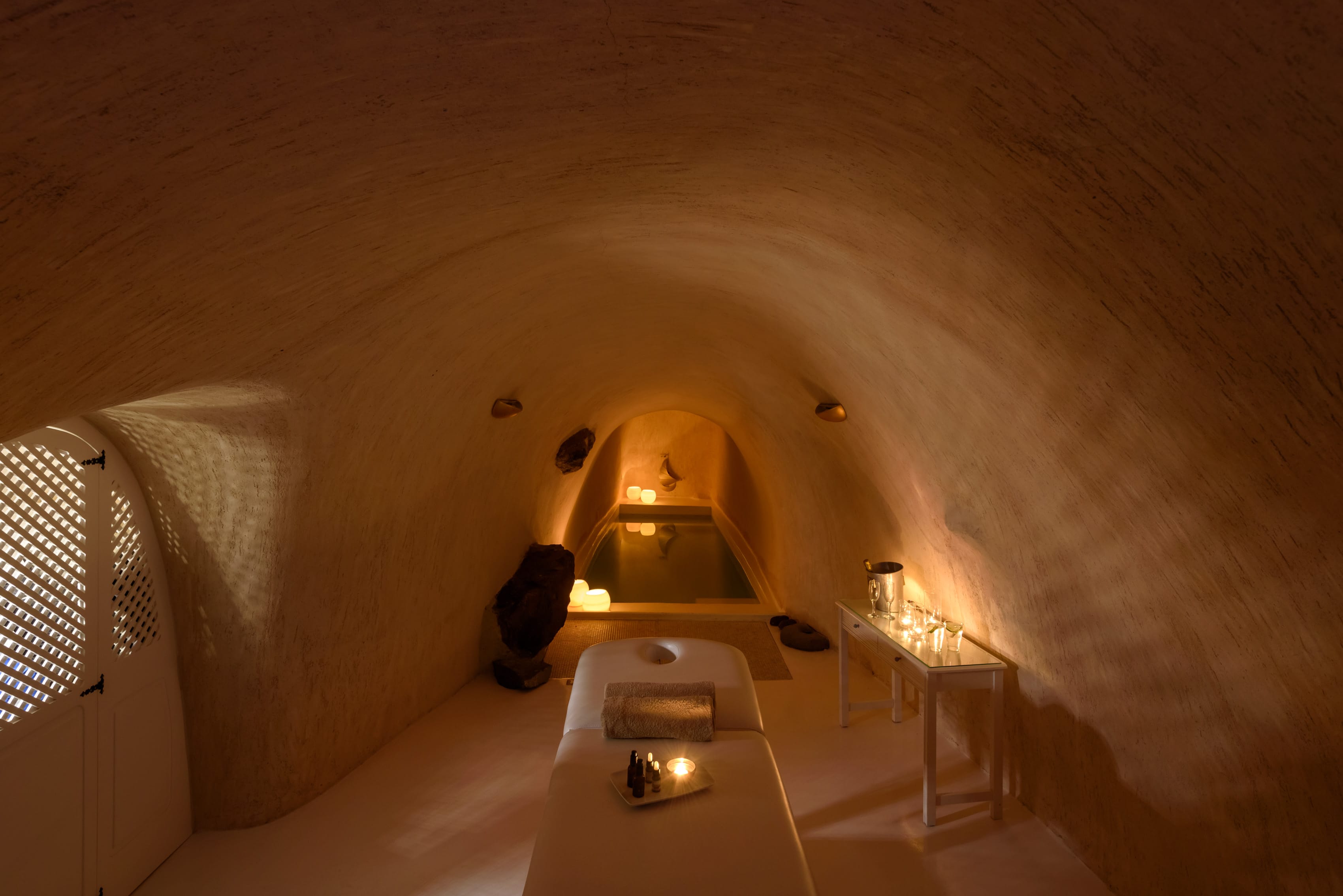 a room with a bed and a lamp