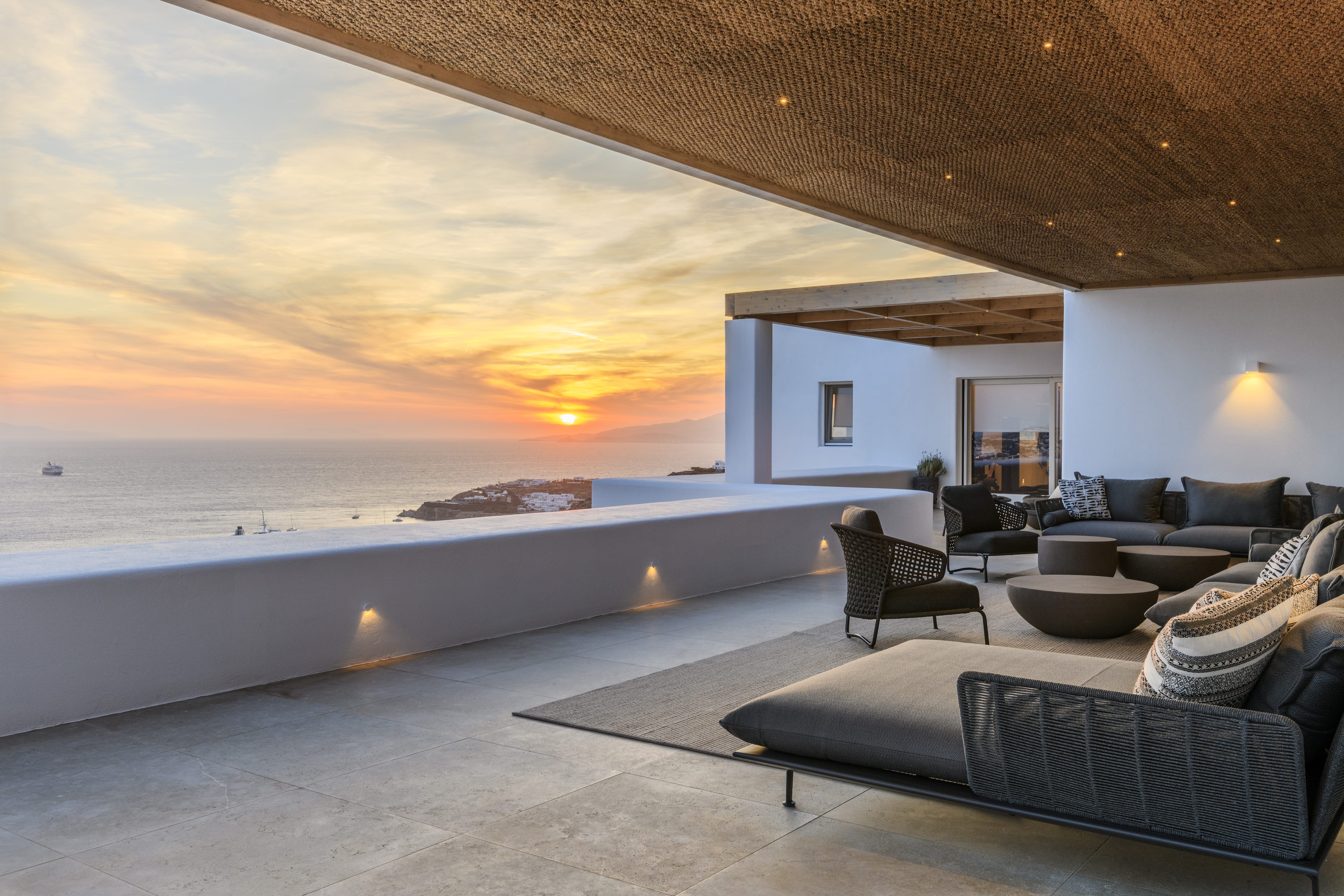 a room with a large pool and chairs