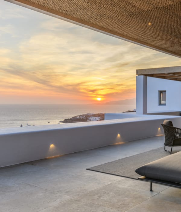 a room with a large pool and chairs