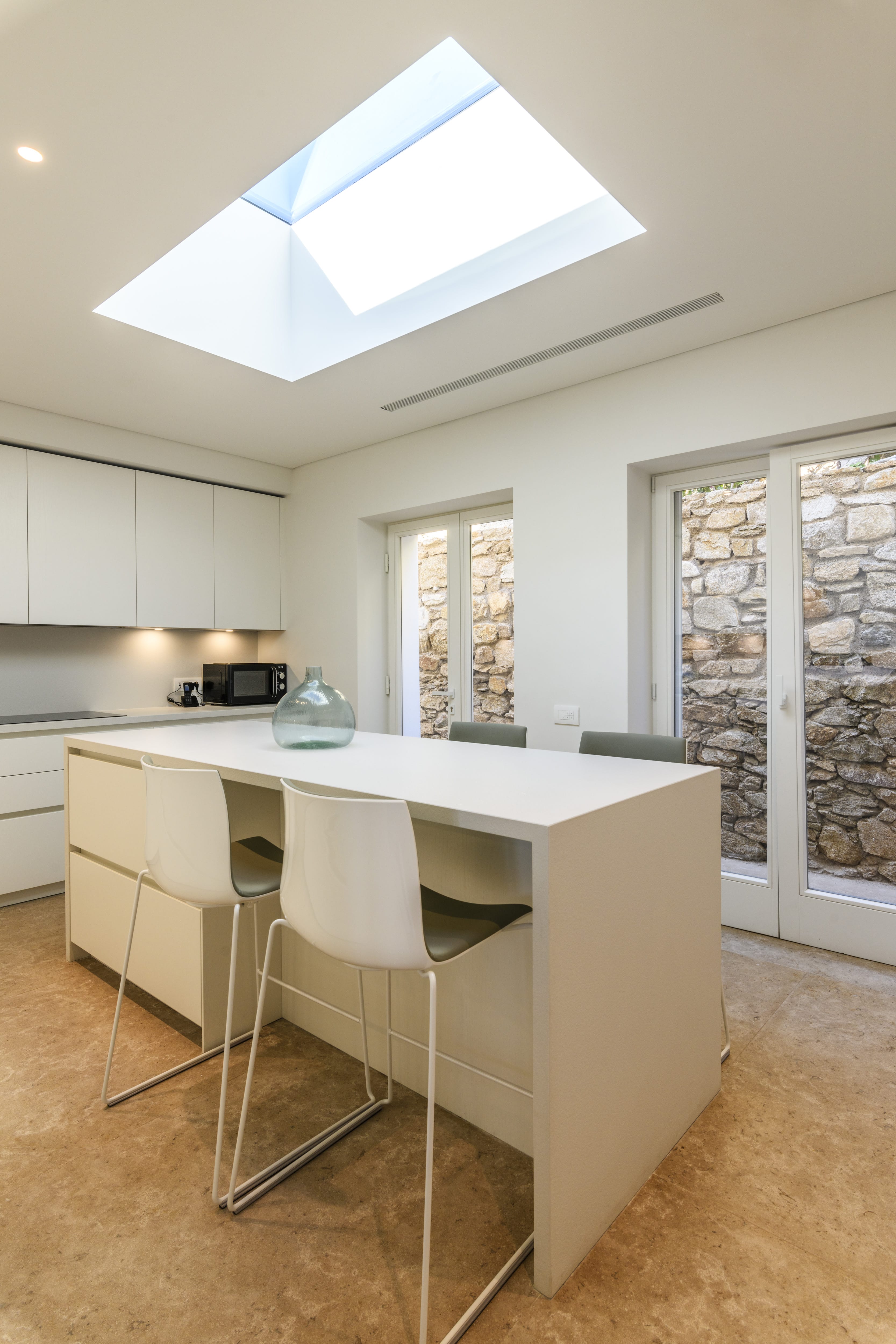 a kitchen with a table and chairs