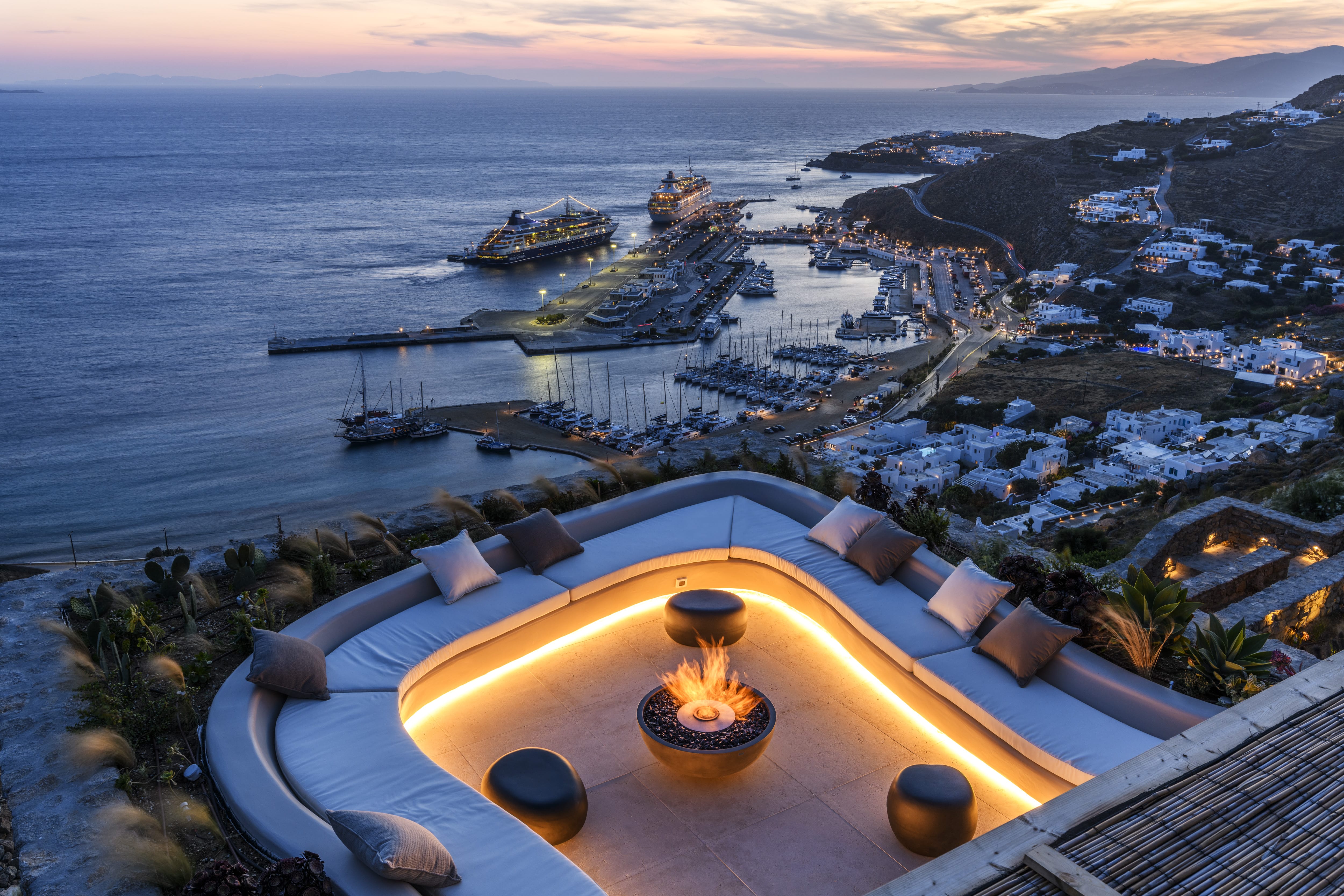 a view of a city and the ocean from a balcony