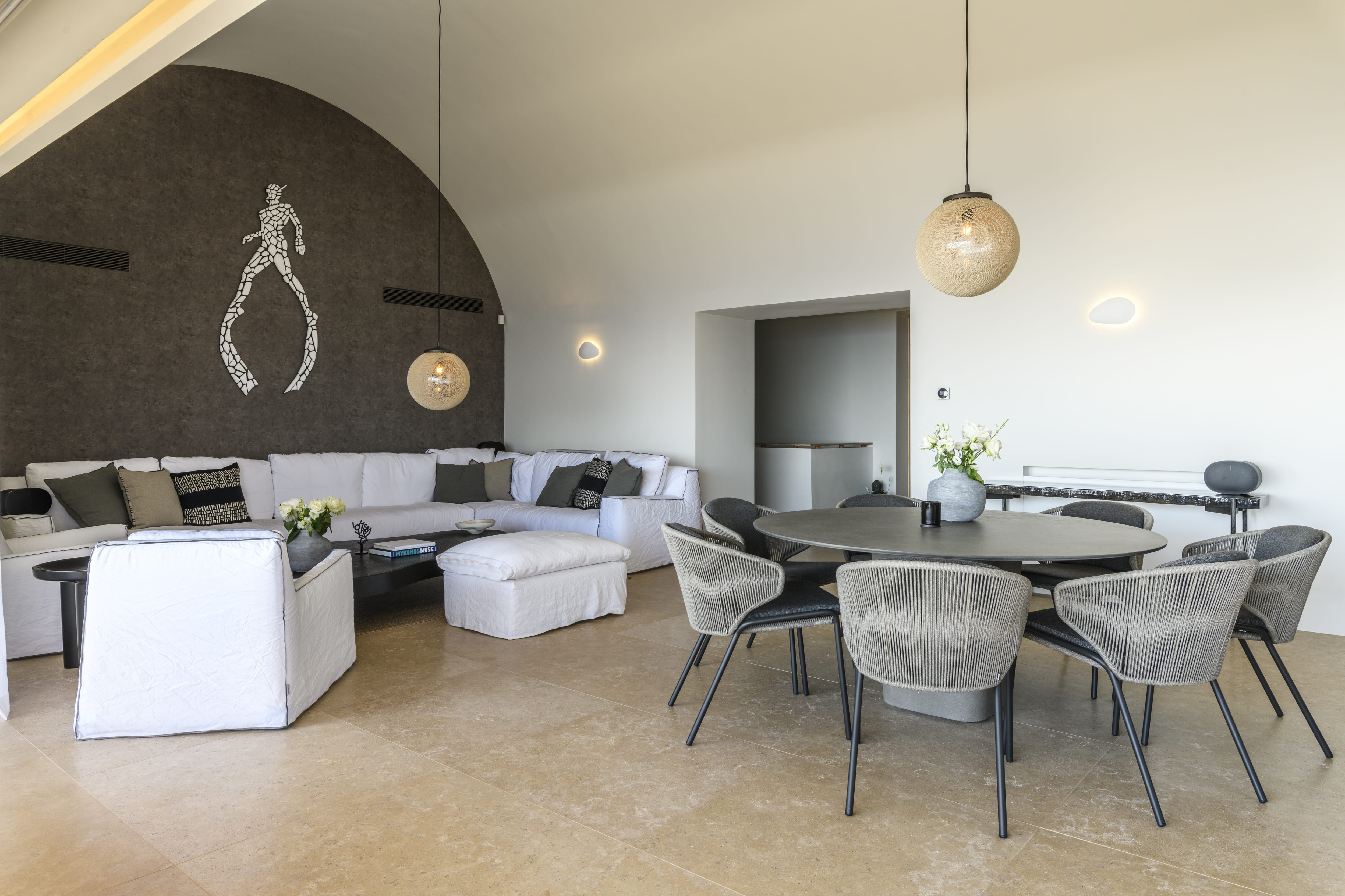 a room with a table chairs and a couch