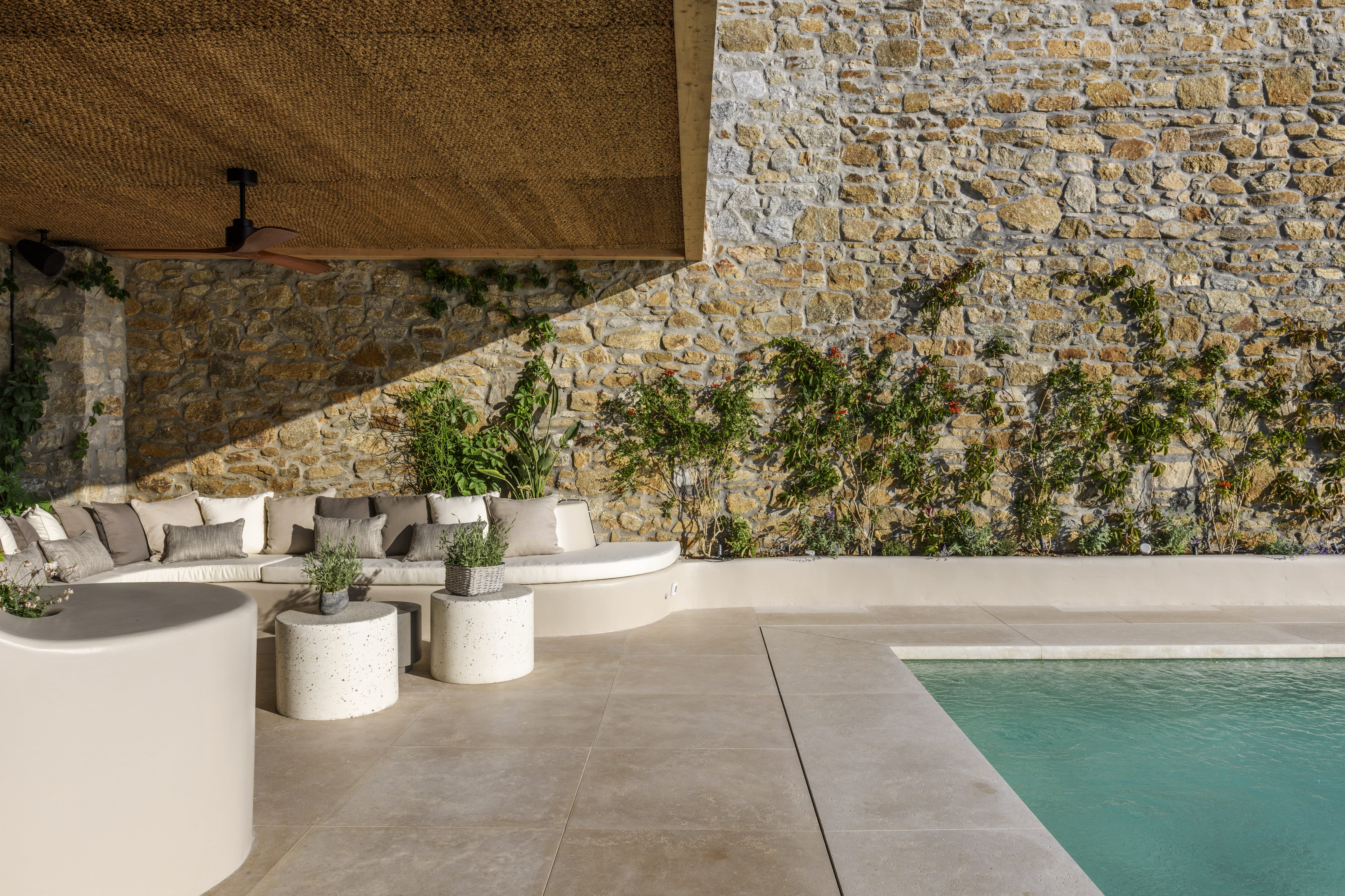 a pool with white tubs